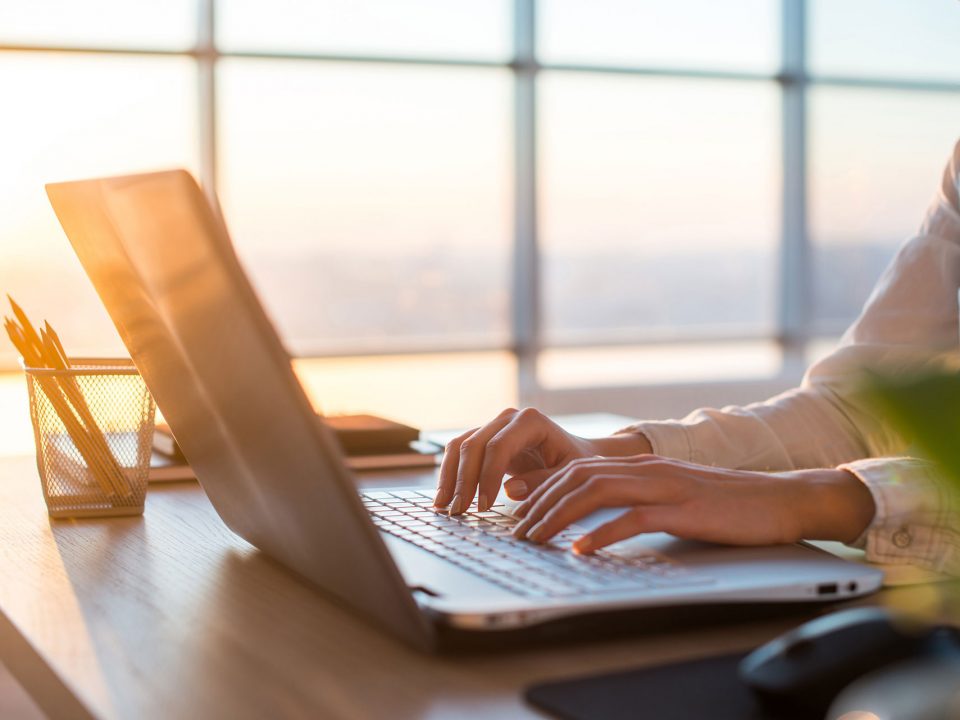 Person typing on a computer